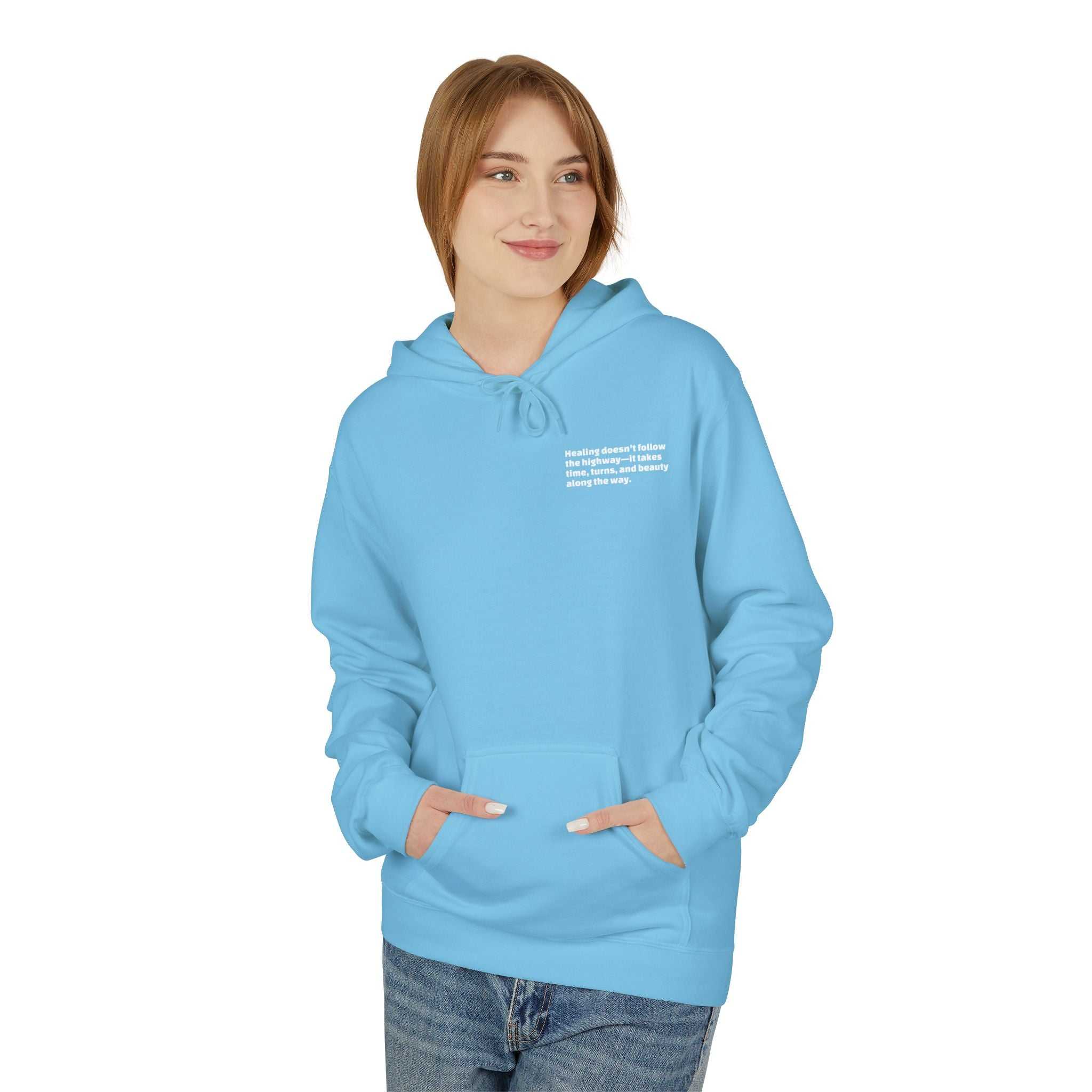 woman wearing light blue inspirational travel hoodie with front pouch pocket and hood