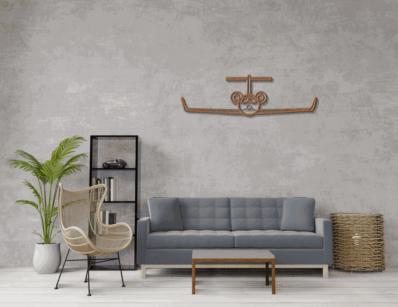 Metal wall art aviation-themed steel silhouette mounted above gray sofa in modern living room