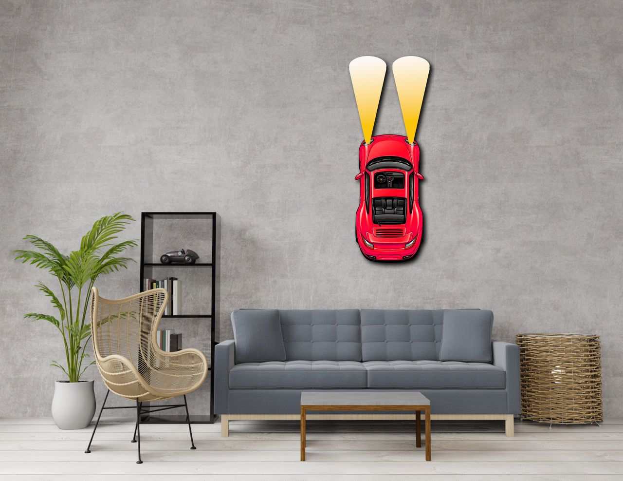 Red metal car wall art with headlights mounted on living room wall above gray sofa.