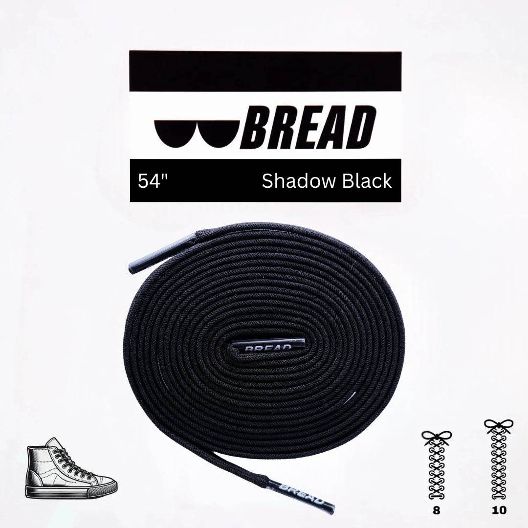 Shadow Black stretchy Bread Laces securely tied on black shoes for easy slip-on