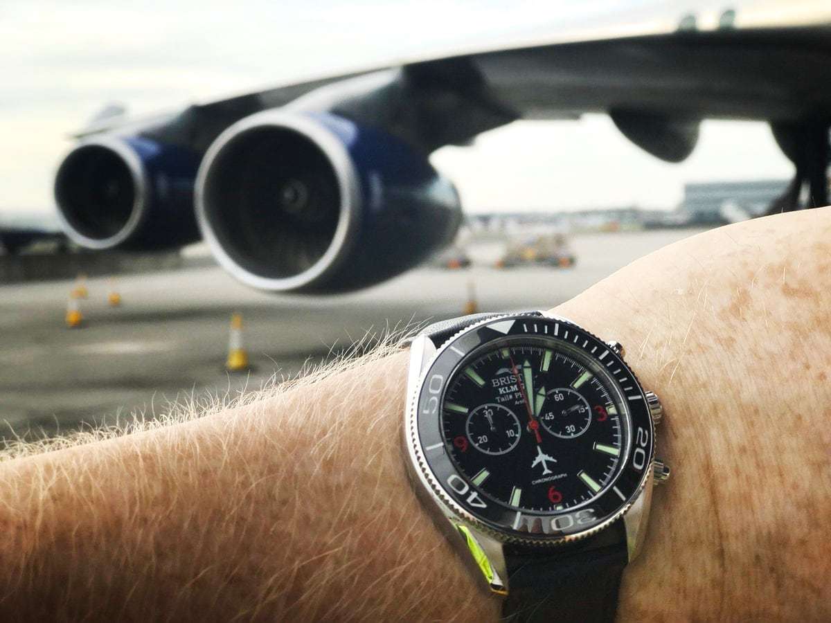 747 Tribute stainless steel watch with black dial and KLM 747 airframe artifact