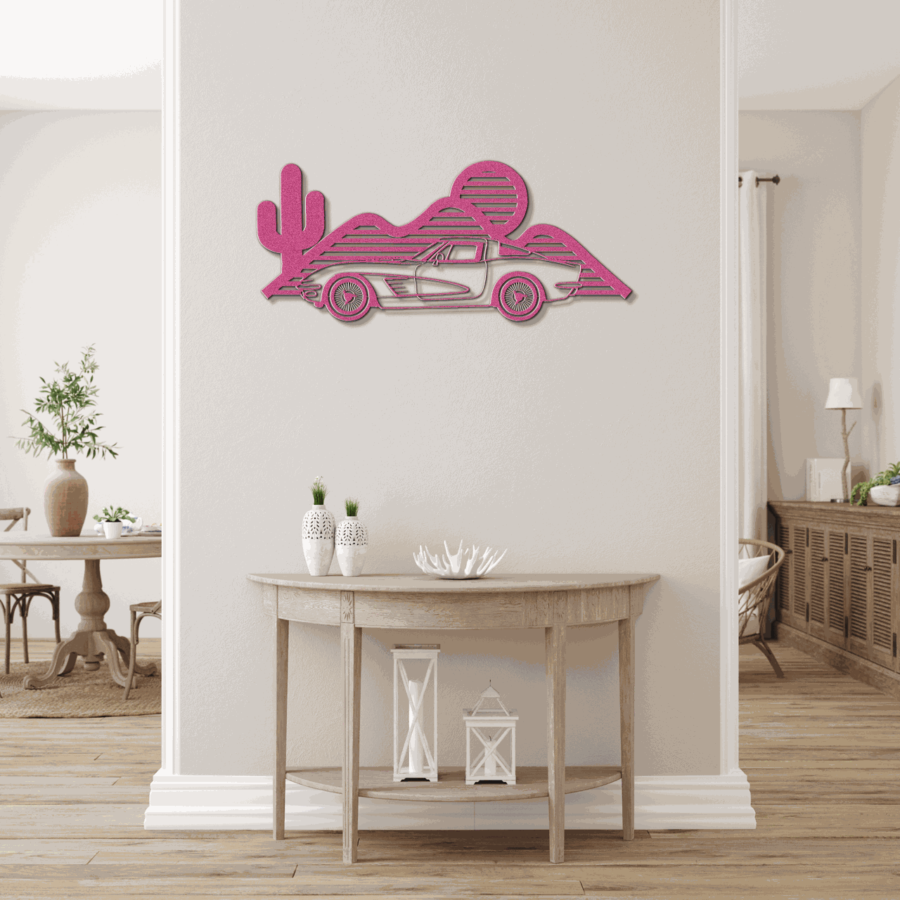 Pink Corvette silhouette metal wall art mounted on a light beige wall above a wooden console table in a modern living space