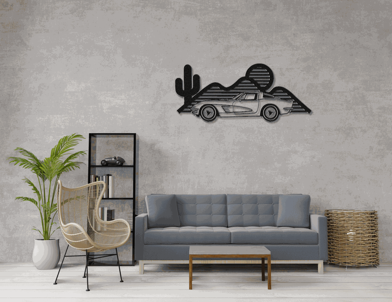 Corvette silhouette metal wall art in matte black steel mounted above a gray sofa in modern living room.