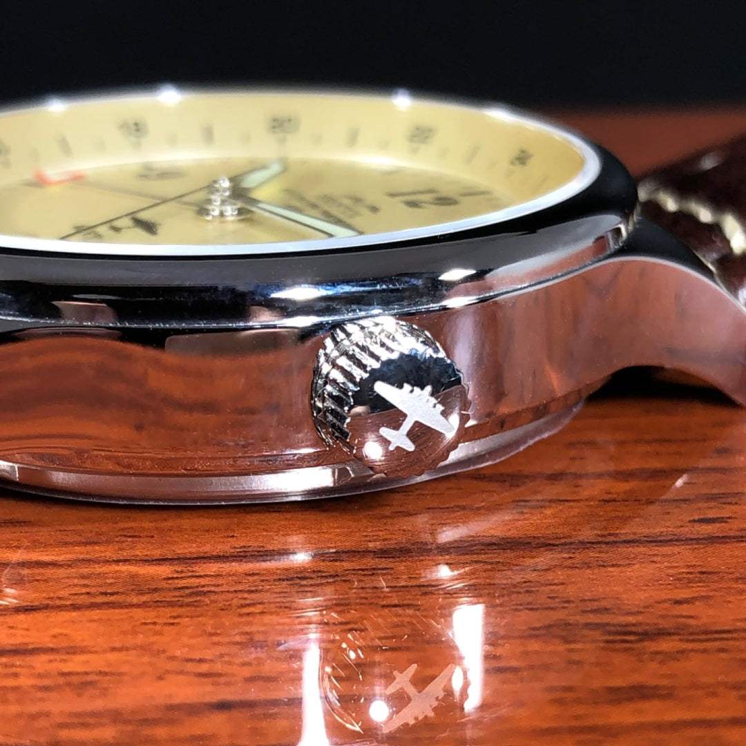 B-17 Flying Fortress tribute watch with polished stainless steel case, beige dial, and brown leather strap