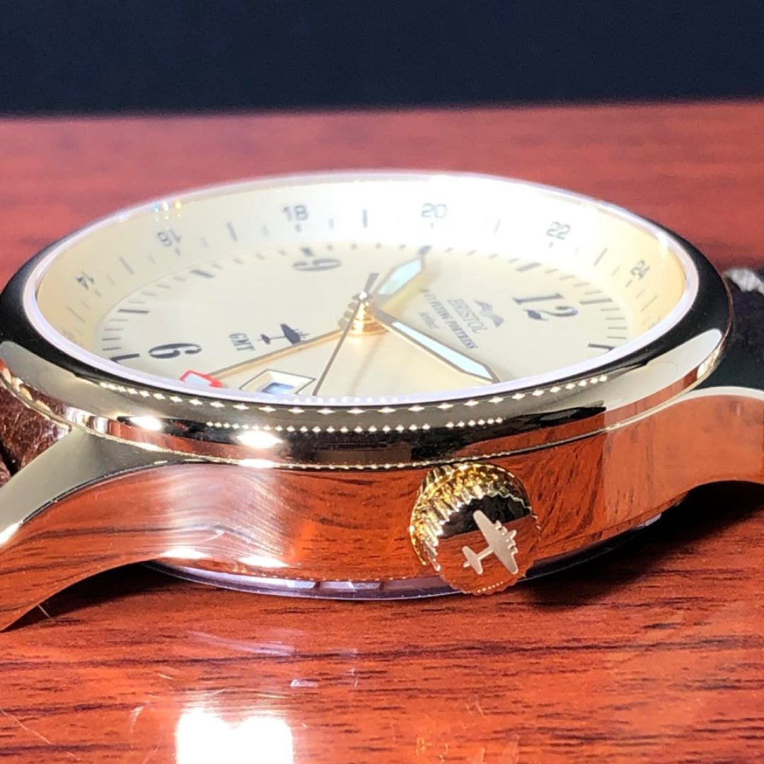 B-17 Tribute watch with gold finish, beige dial, stainless steel case, and brown leather band