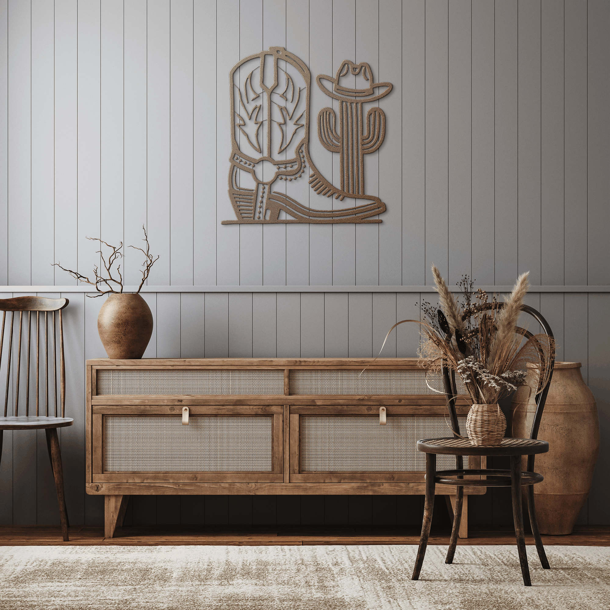 Cowboy boot and cactus metal wall art in rustic western style above wooden sideboard in cozy living room