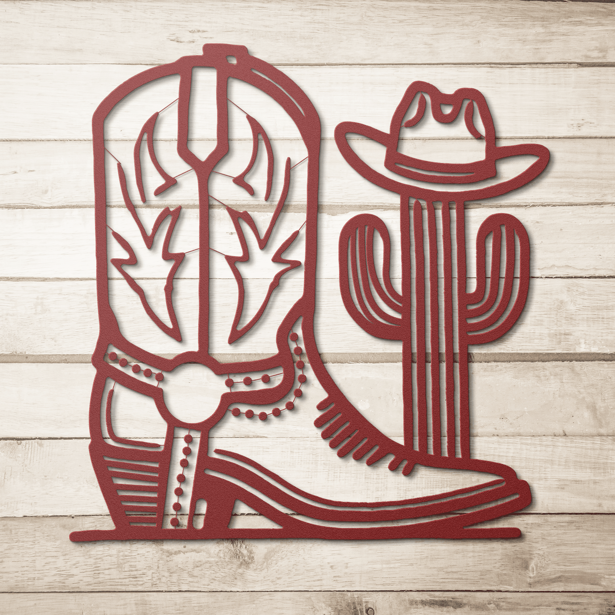 Red metal wall art featuring a cowboy boot and cactus with a hat, western decor cut from 18-gauge steel
