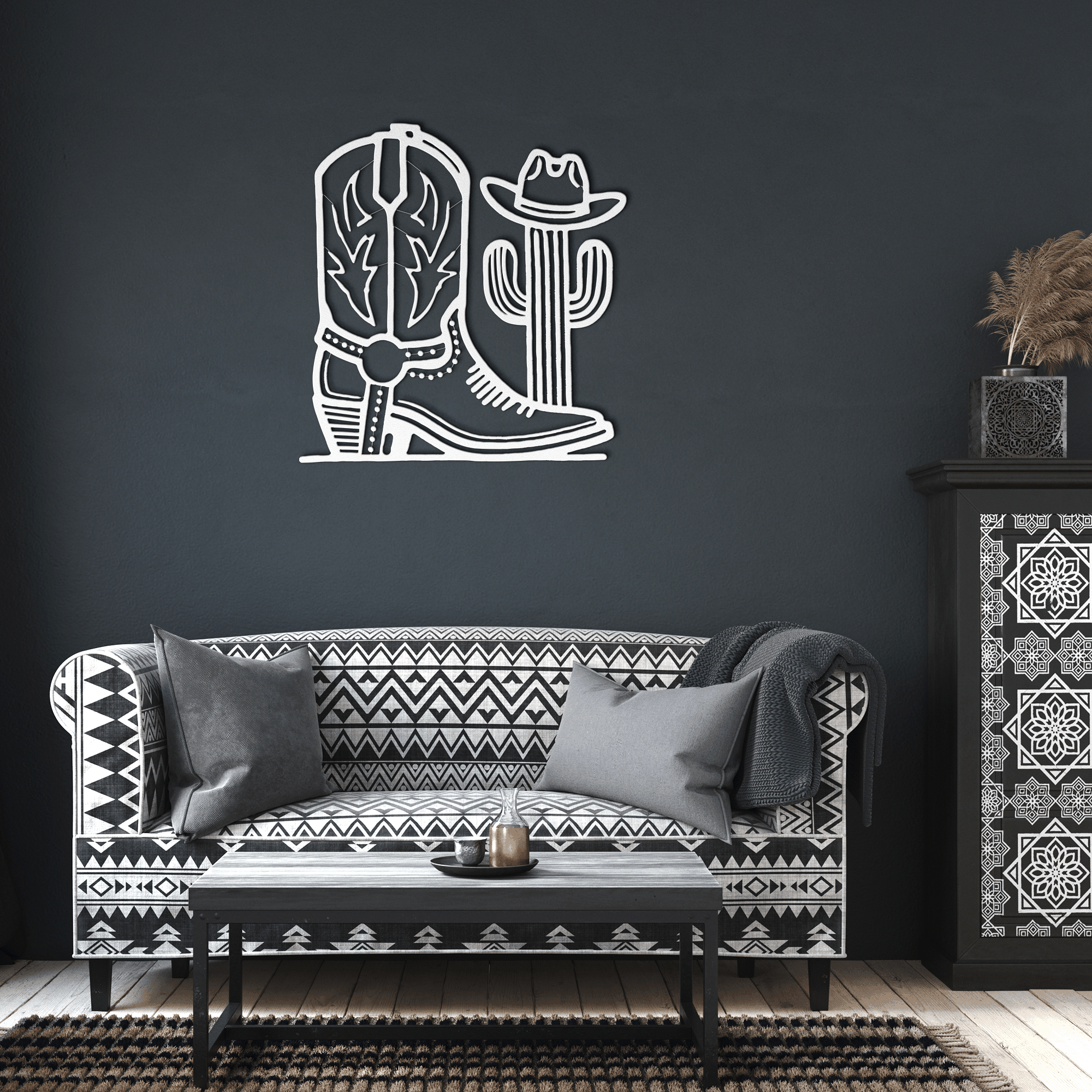Cowboy boot and cactus metal wall art in white 18-gauge steel, western decor above patterned sofa