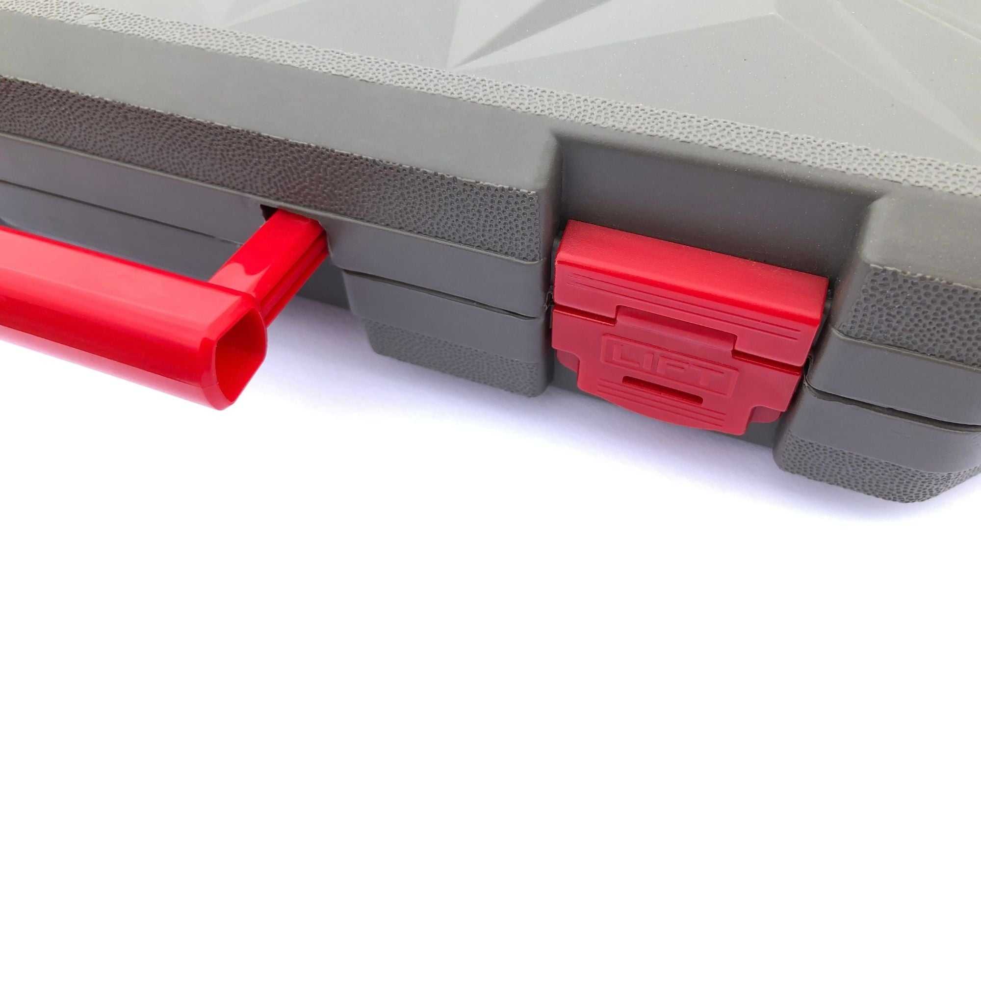 Compact gray and red mechanics tool set case latch detail for small engine and general repairs.