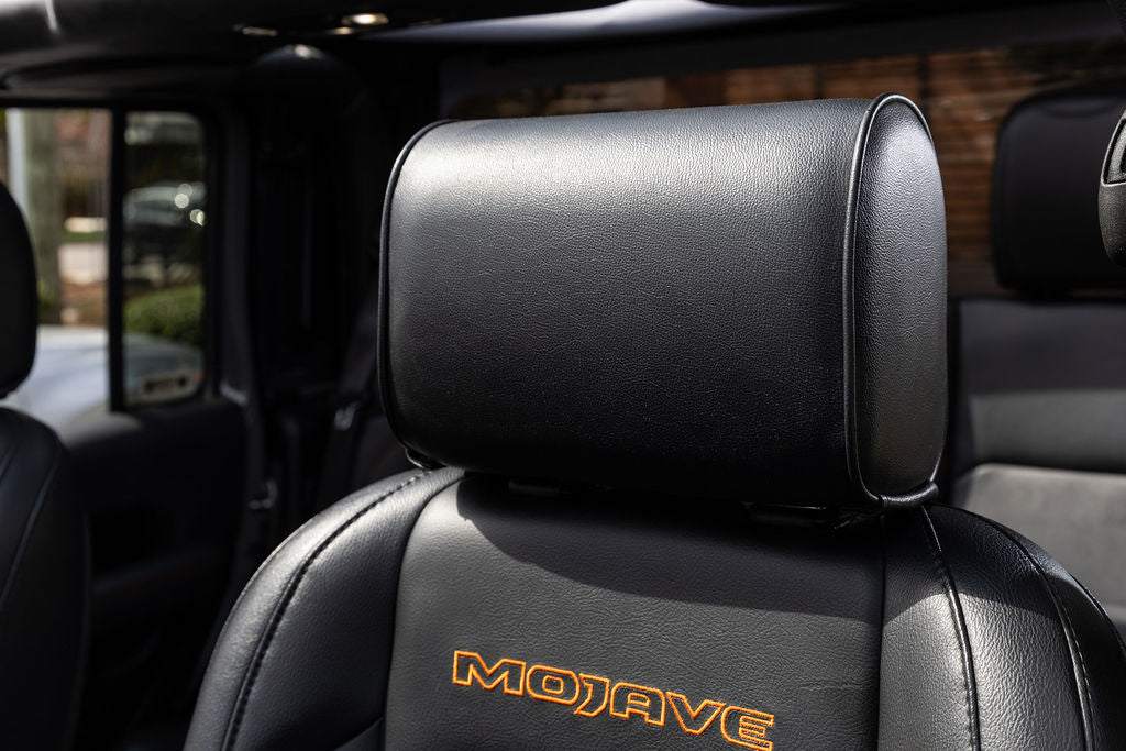 Compact Headrest Safe with slim profile and secure keypad lock for sedans and luxury vehicles