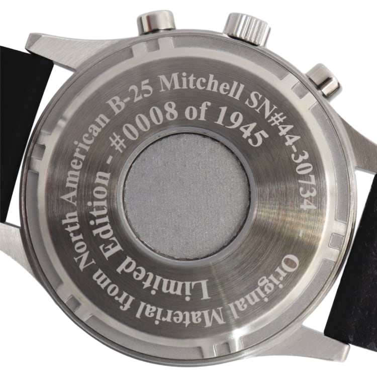 Close-up of B-25 pilot watch case back with engraved limited edition details and authentic B-25 Mitchell airframe material.