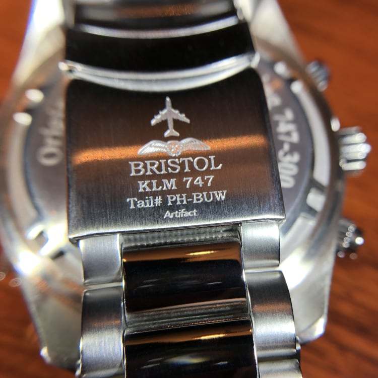 747 Tribute stainless steel watch with white dial and KLM 747 airframe artifact