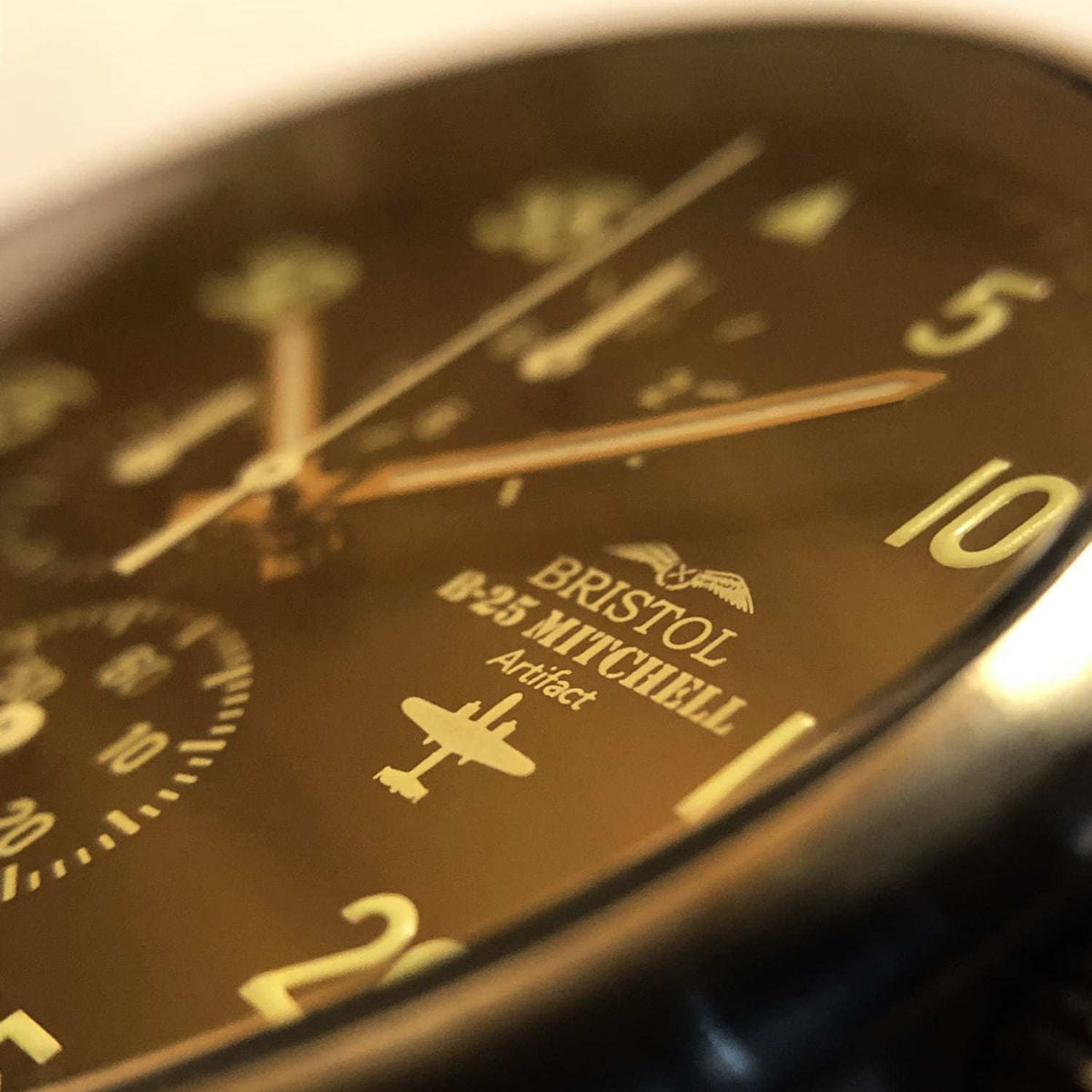 B-25 Mitchell tribute watch with stainless steel brushed case, black dial, and brown leather stitched band