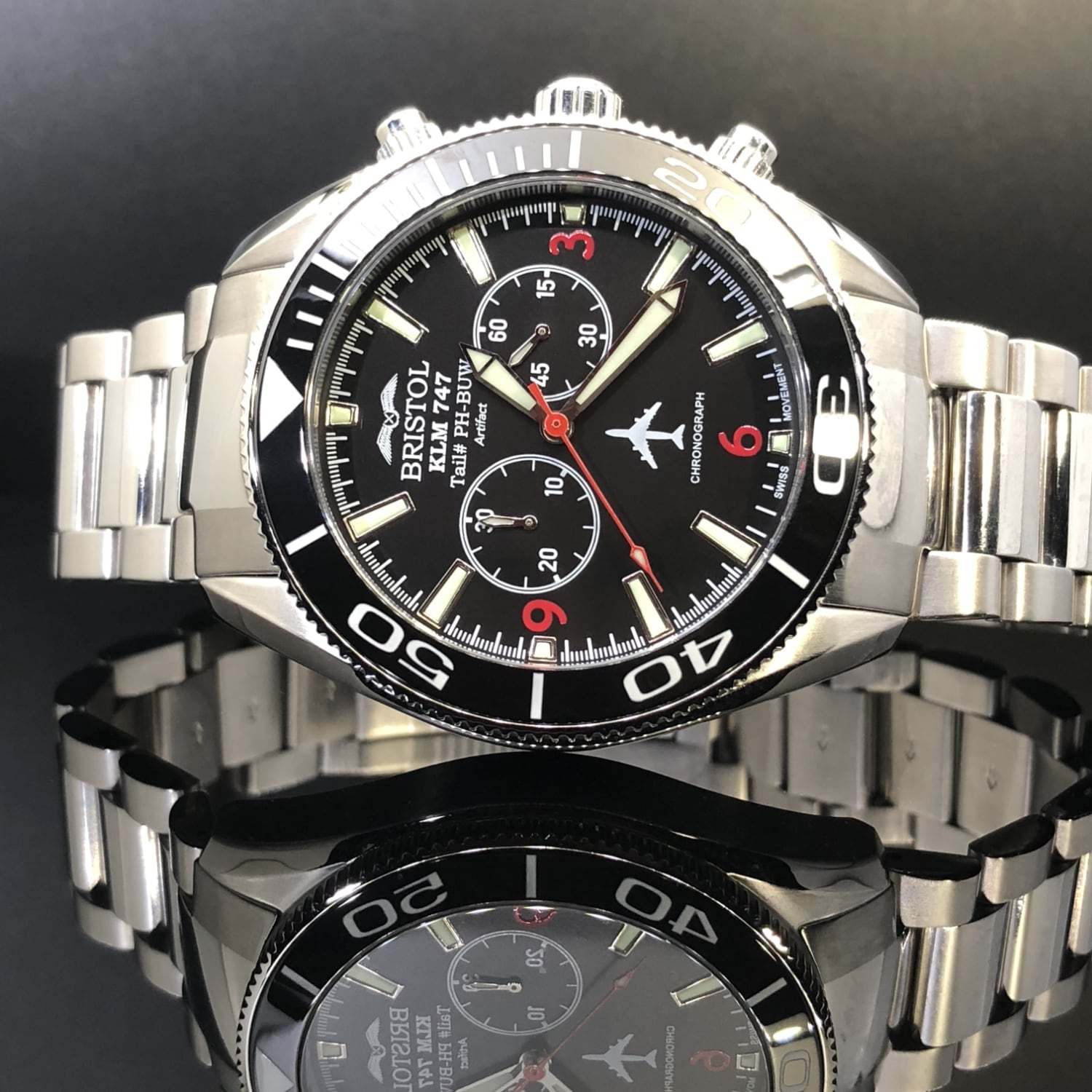 747 Tribute stainless steel watch with black dial and KLM 747 airframe artifact