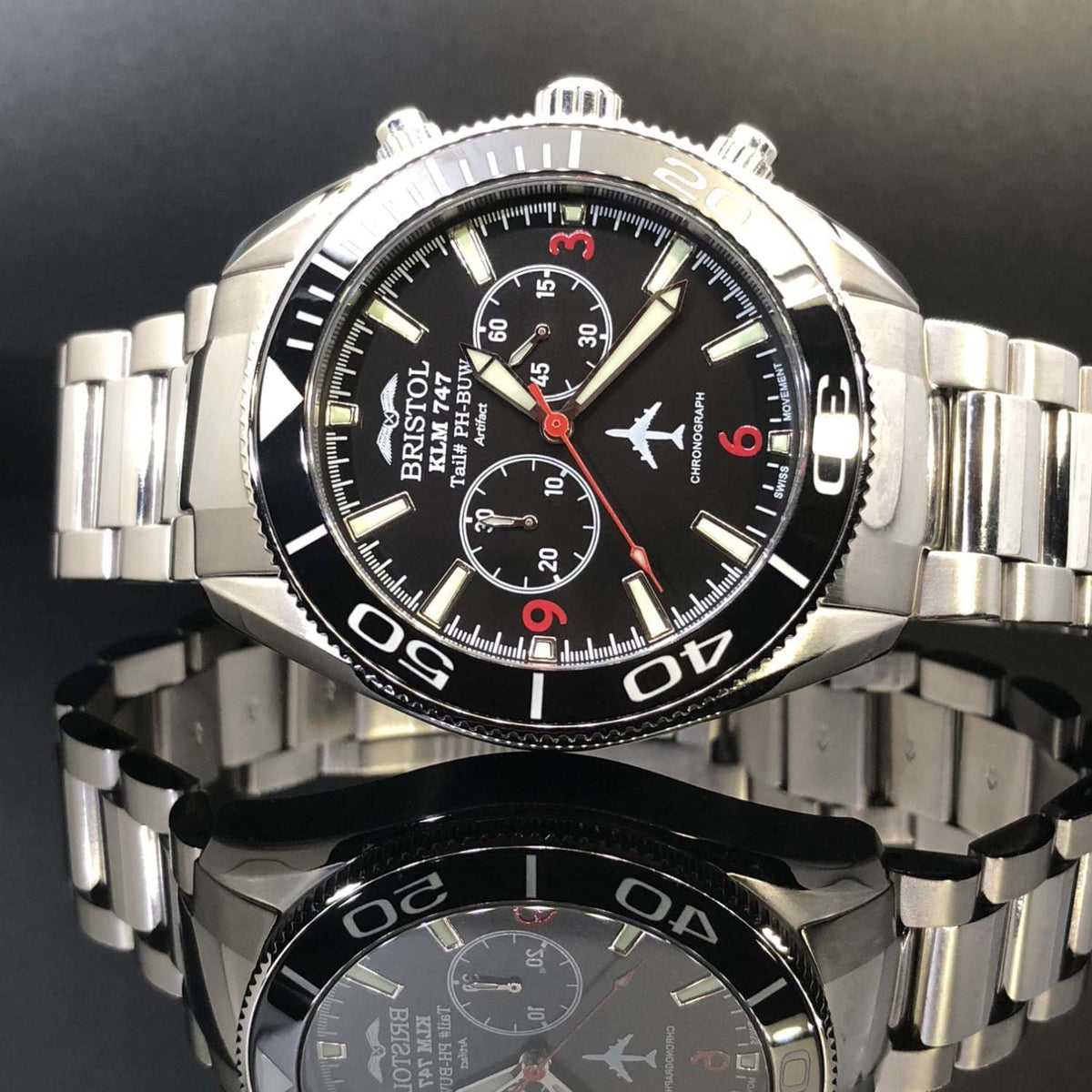 747 Tribute stainless steel watch with black dial and KLM 747 airframe artifact