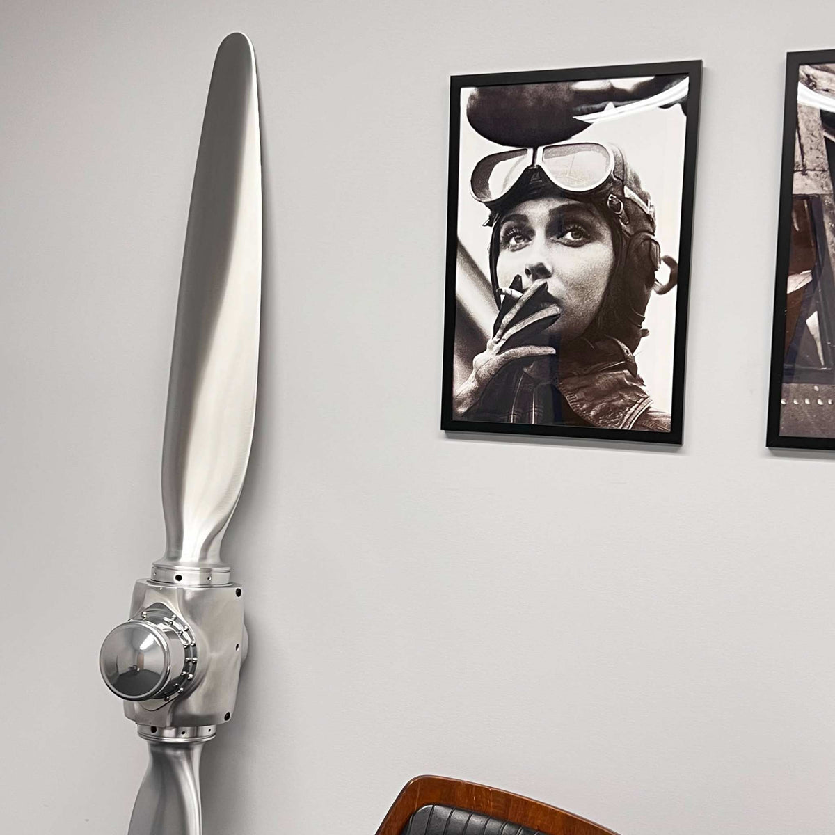 2-bladed McCauley aluminum metal airplane propeller with brushed aluminum finish and chrome powder-coated parts for wall display