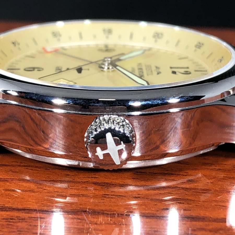 P-51 Mustang Tribute watch with polished stainless steel case, beige dial, and brown leather strap