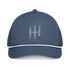 Navy blue manual transmission automotive hat with embroidered stick shift design and white braided rope detail on bill