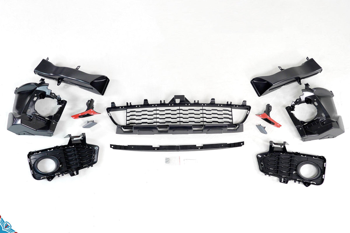 Blue BMW 4 Series F32 coupe with M Sport style front bumper conversion kit installed
