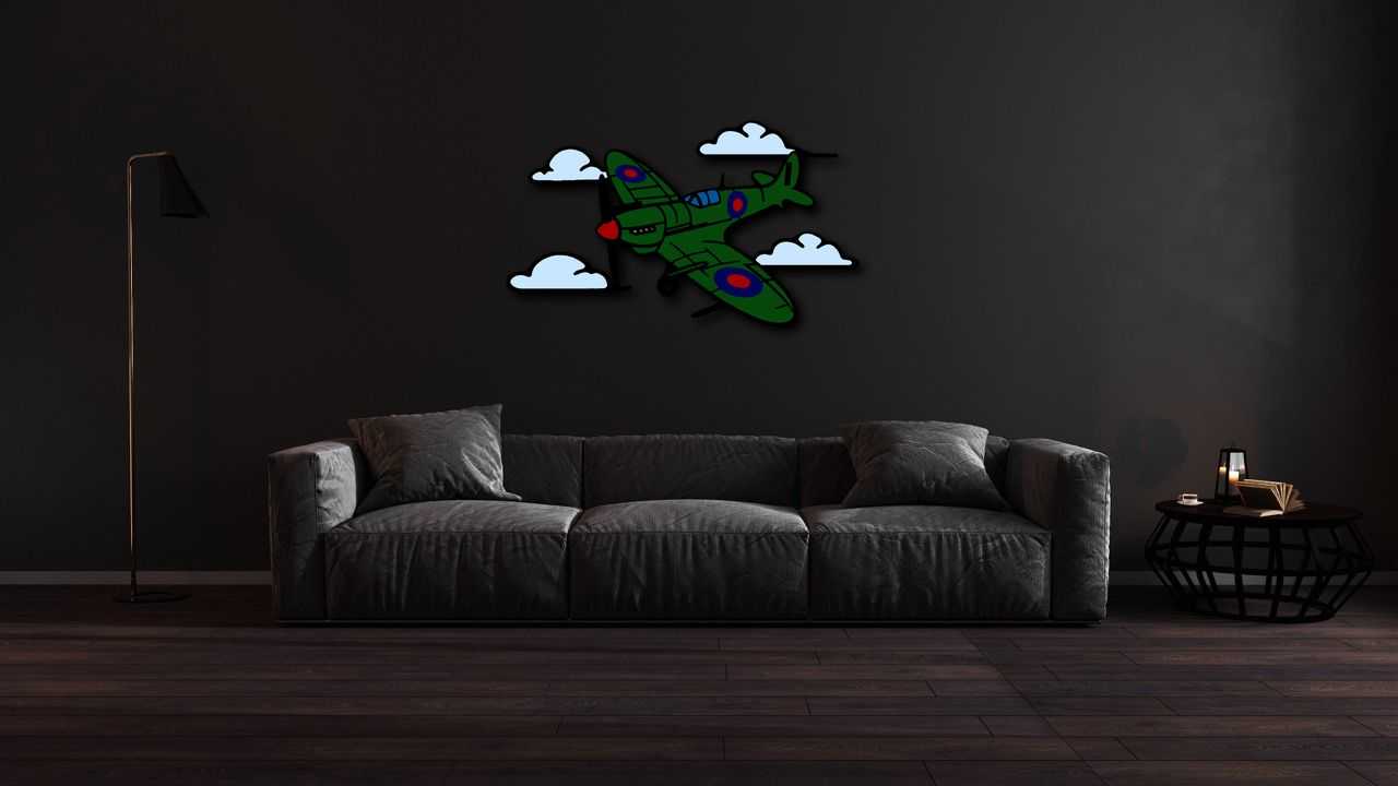 Multicolor metal sign of a green Spitfire plane with clouds on dark living room wall