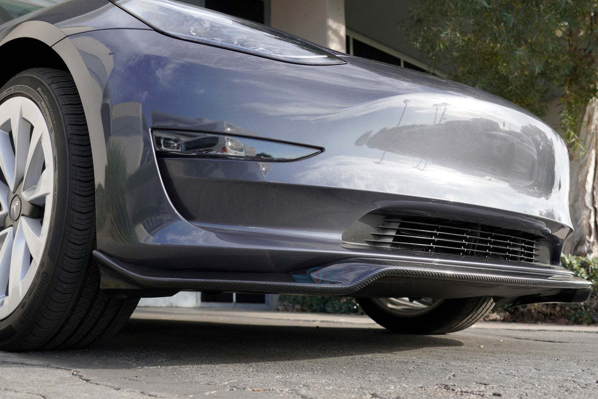 Green wrapped Tesla Model 3 with FYBR ATS style genuine carbon fiber front lip installed