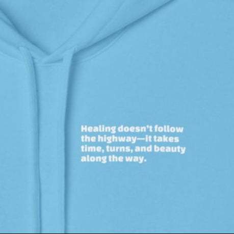 Blue Inspirational travel hoodie with white motivational text "Healing doesn&