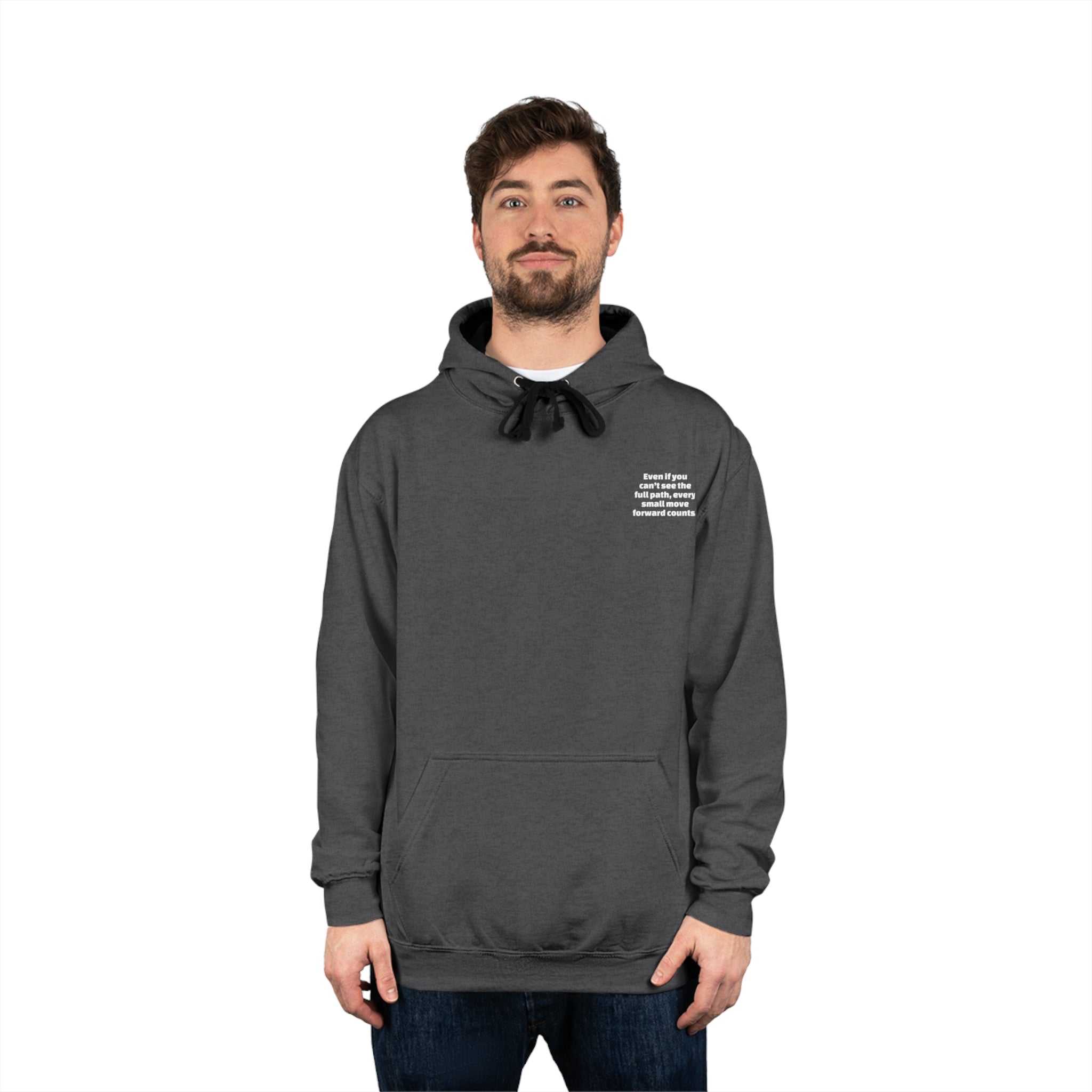 Man wearing dark gray inspirational motivational varsity hoodie with kangaroo pocket and contrast black drawstring hood