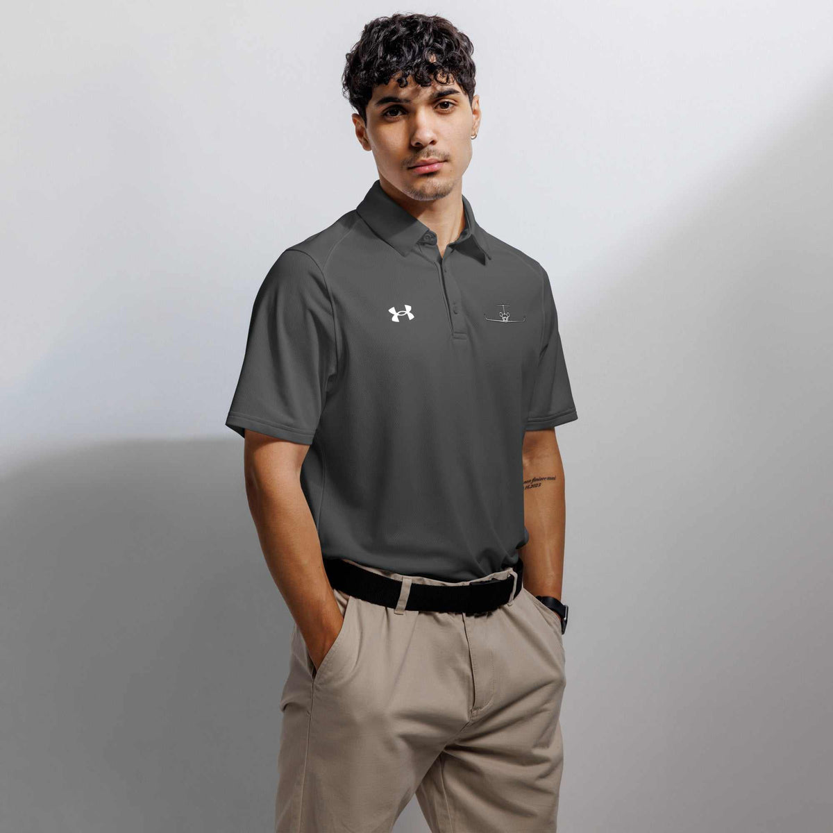 Men's pilot polo shirt with embroidered private jet logo, moisture-wicking performance fit in black, white, and navy