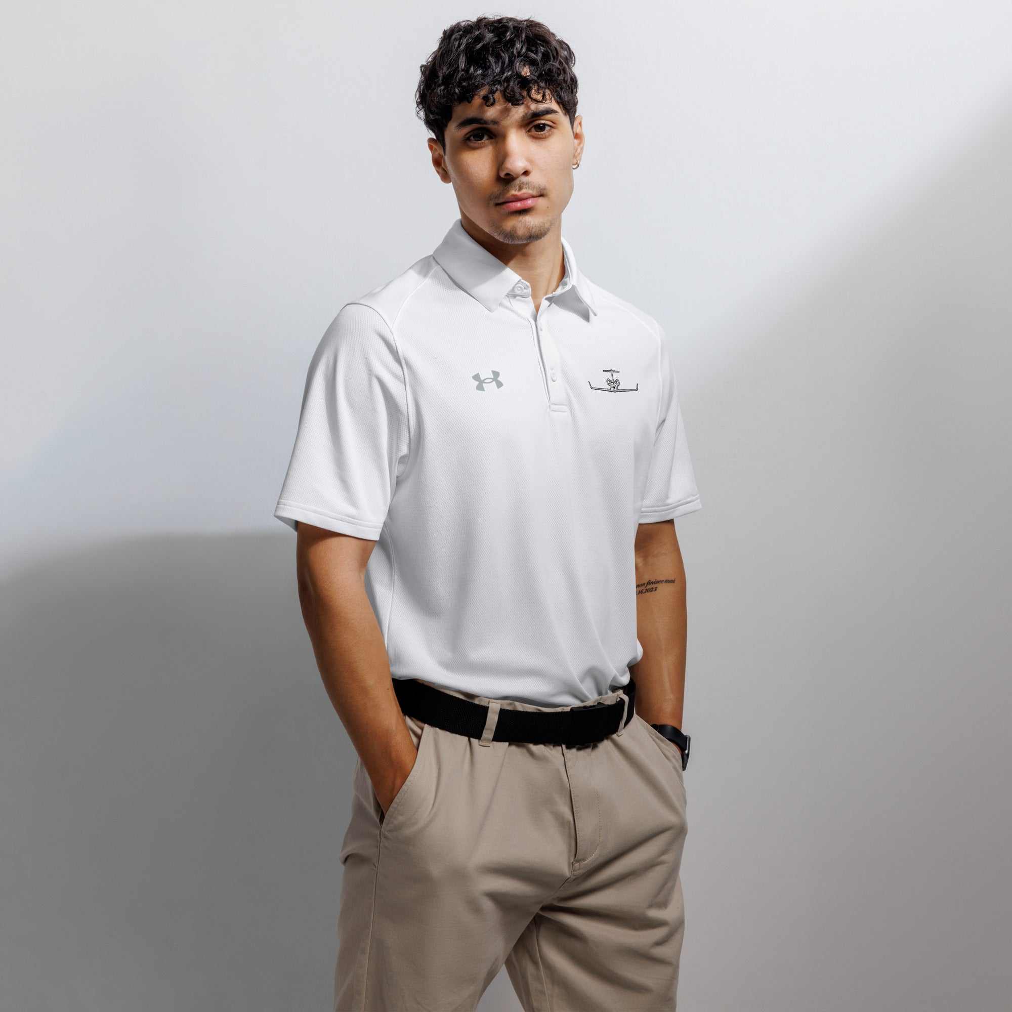 White pilot polo shirt with embroidered private jet logo, performance fit, and moisture-wicking fabric