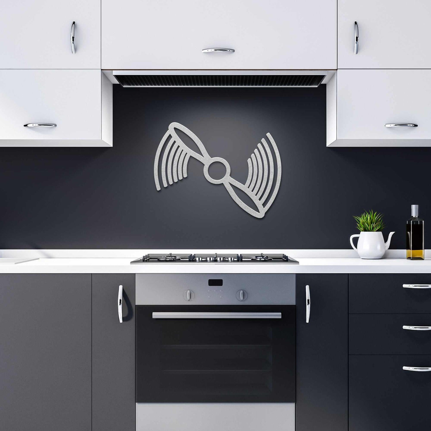 Modern kitchen with Propeller Metal Wall Art in silver above stove on black wall