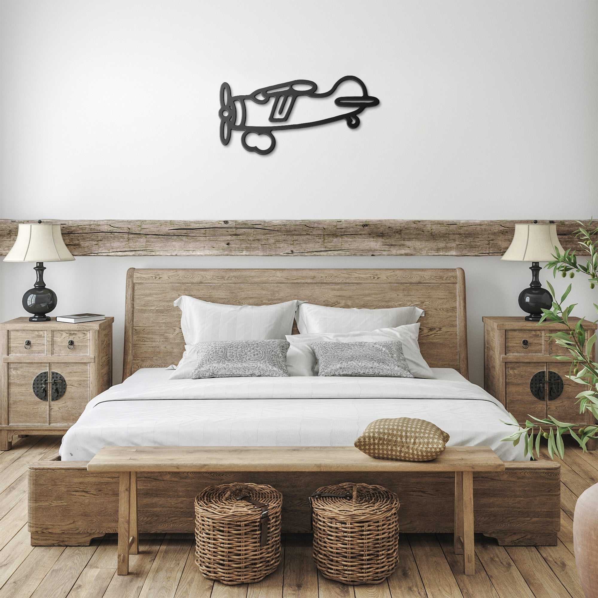 Vintage airplane metal wall art above a cozy bed in a warm-toned bedroom, adding charm to home office decor.