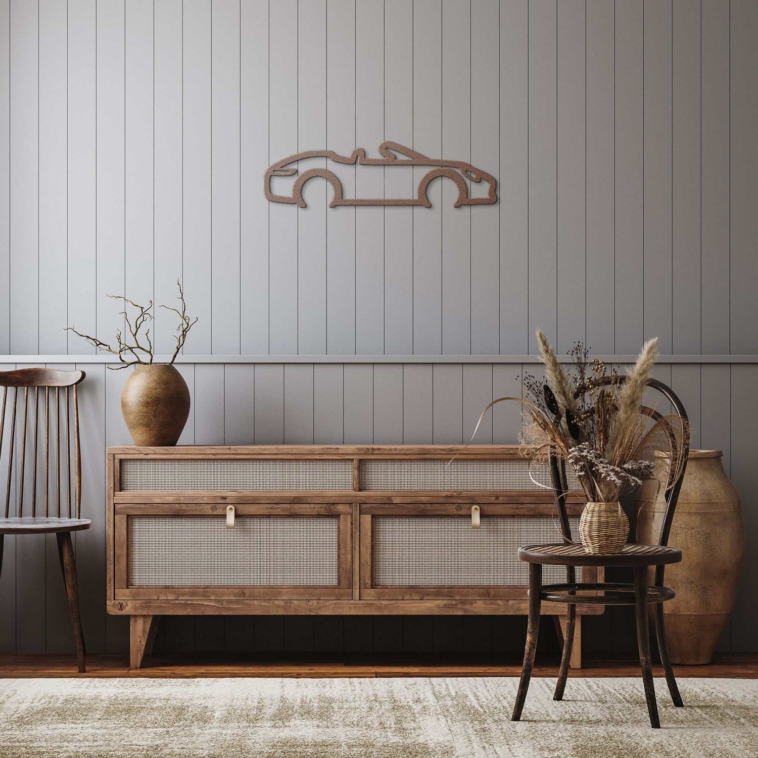 Automotive metal wall art convertible silhouette in powder-coated steel hanging above wooden sideboard in modern room