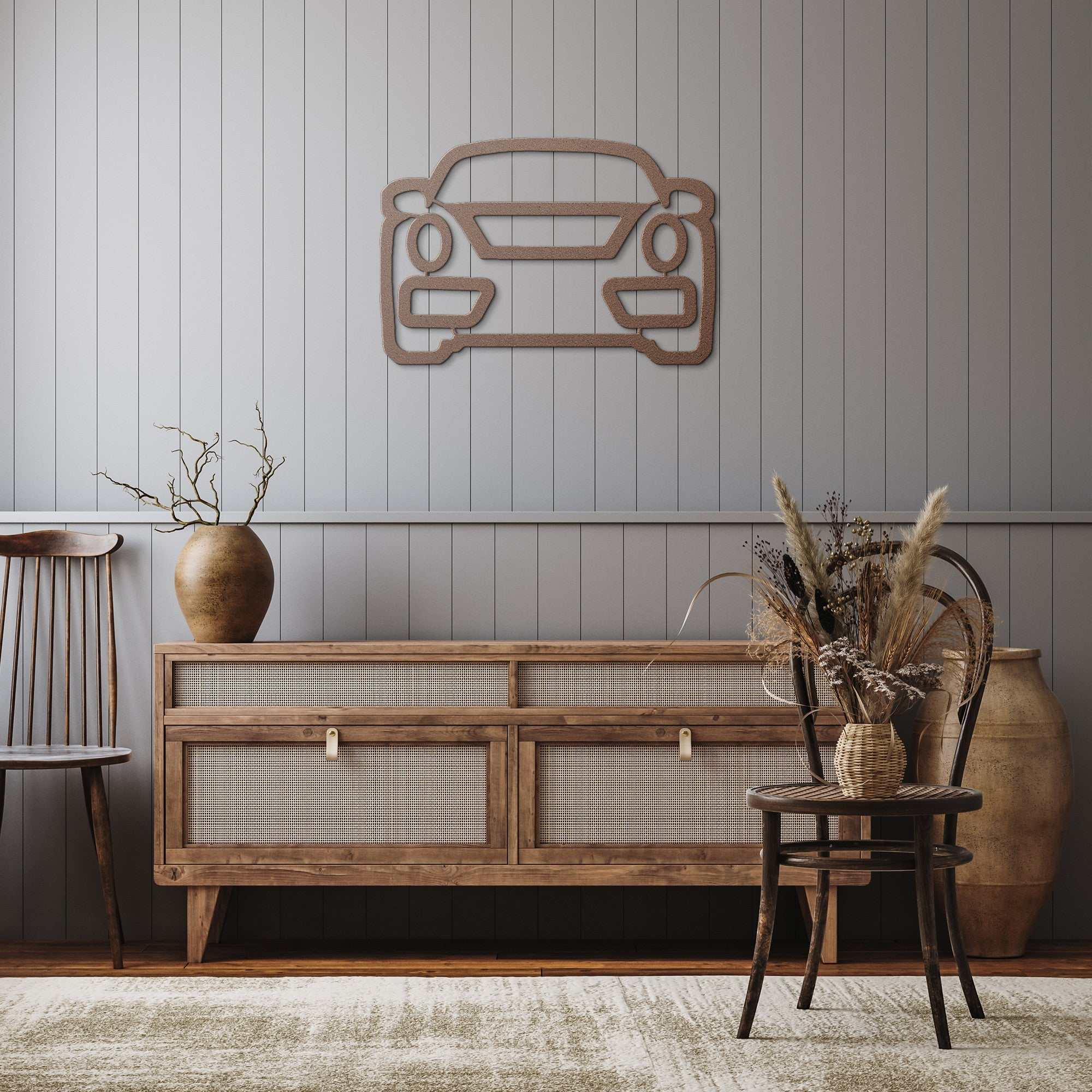 Metal wall art car silhouette mounted on gray paneled wall above wooden sideboard in modern rustic room