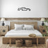 Metal Wall Art Nine Thirty Silhouette in black steel above bed in rustic bedroom