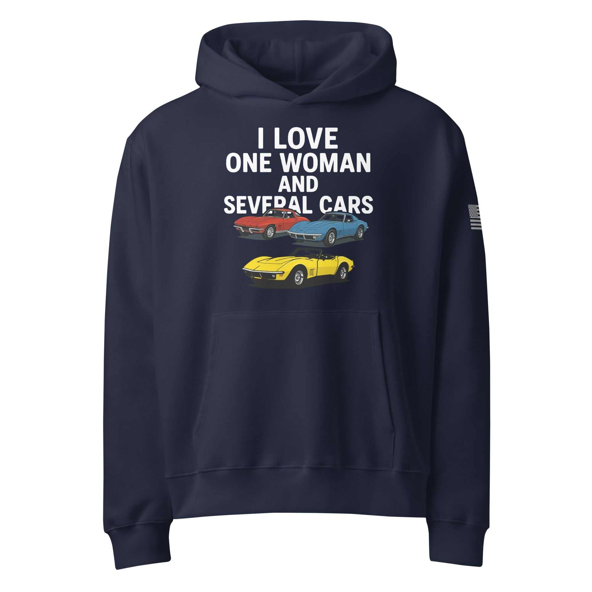Woman wearing oversized heavyweight hoodie standing near several cars outdoors