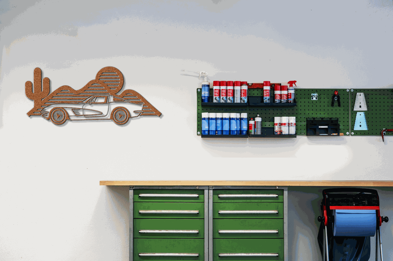 Laser-cut Corvette silhouette wall art in powder-coated steel, ideal for garages and showrooms.