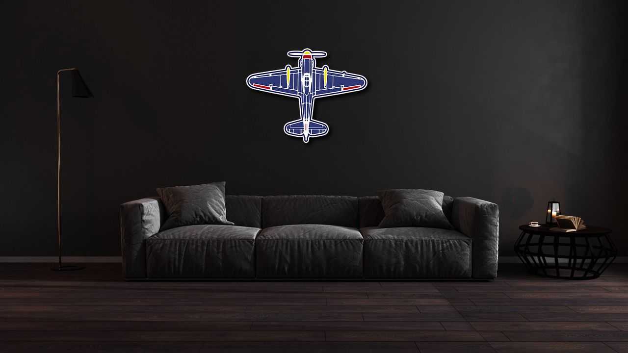 Multicolor classic plane aviation wall art metal sign mounted above dark gray sofa in modern living room