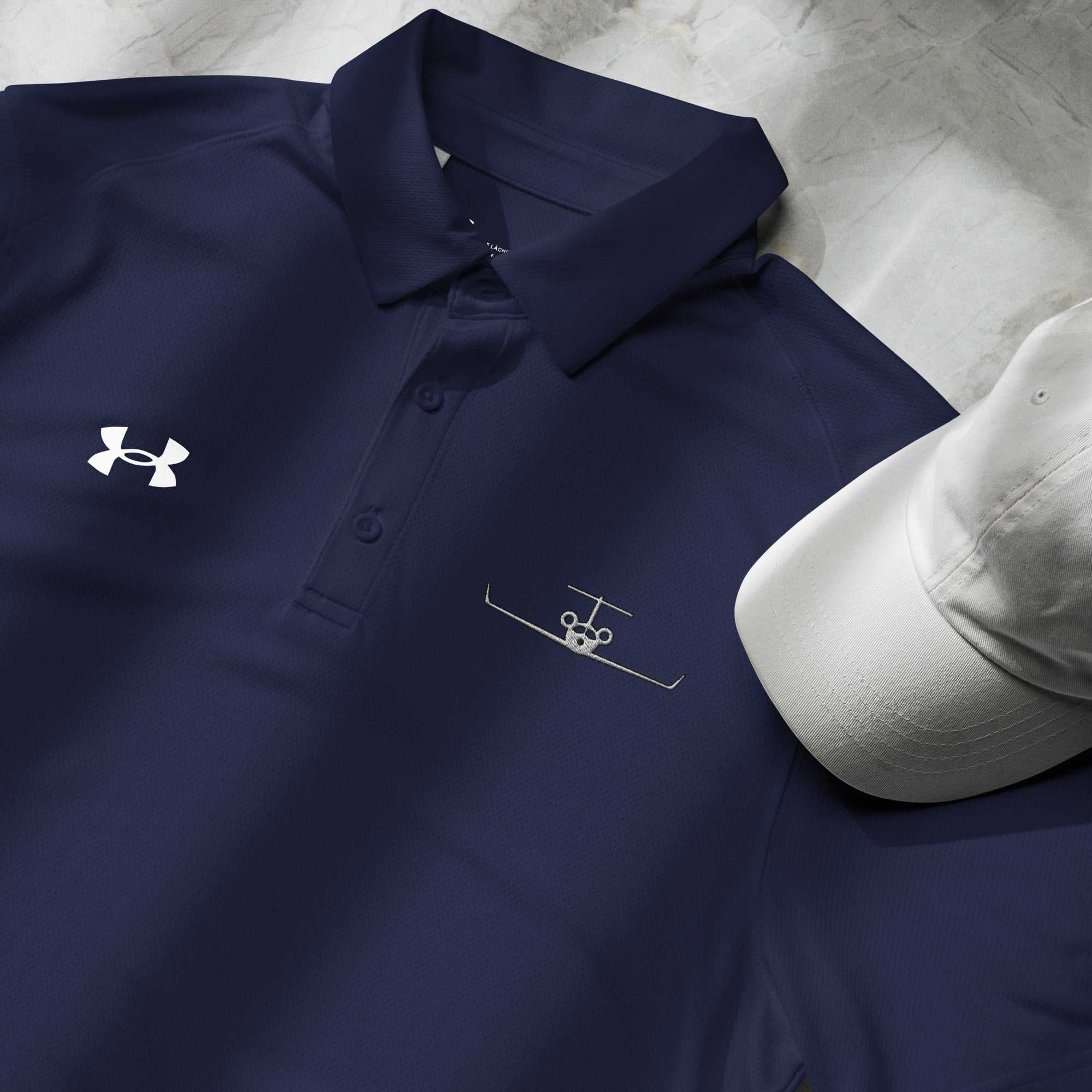 Navy pilot polo shirt with embroidered private jet logo and Under Armour emblem, moisture-wicking performance fabric.