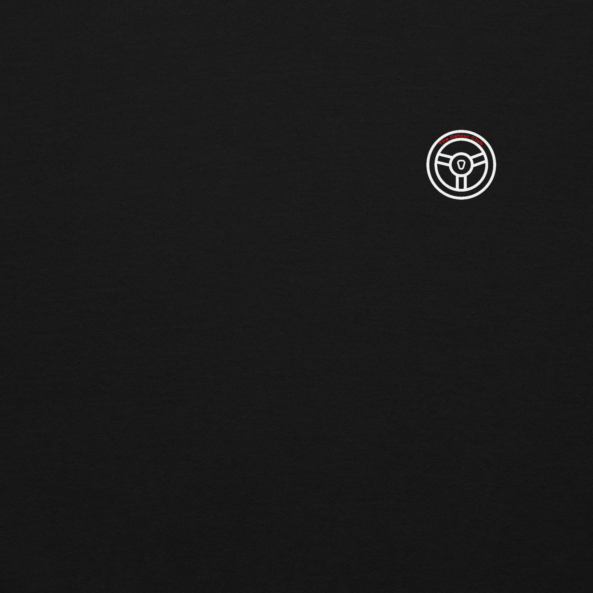 White steering wheel icon on a black background