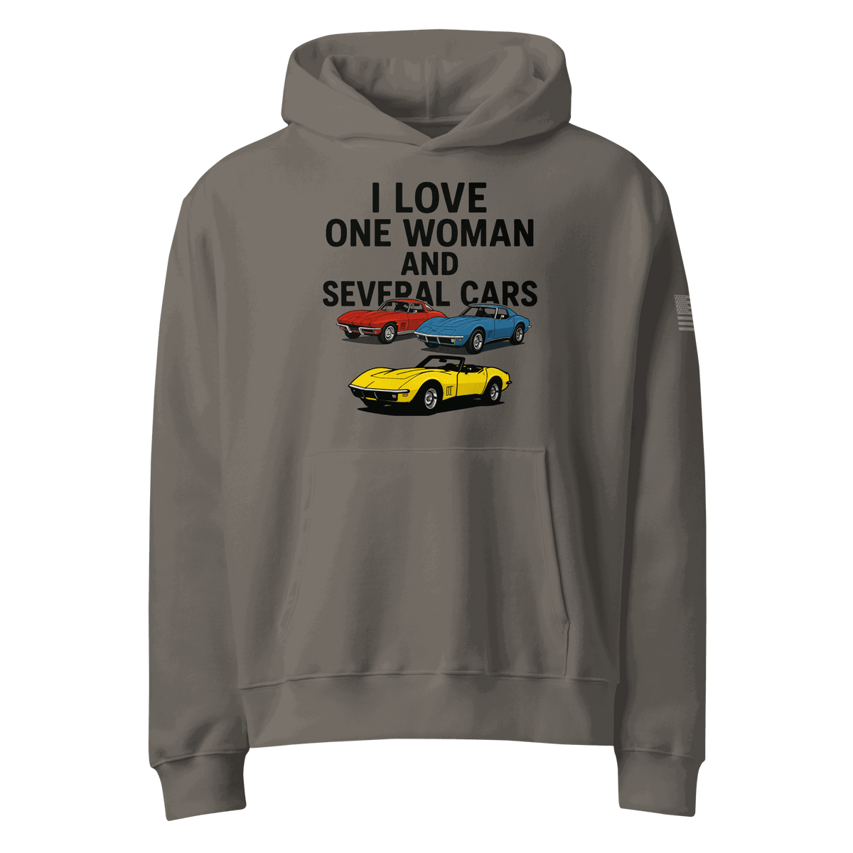 Woman wearing oversized heavyweight hoodie standing near several cars outdoors