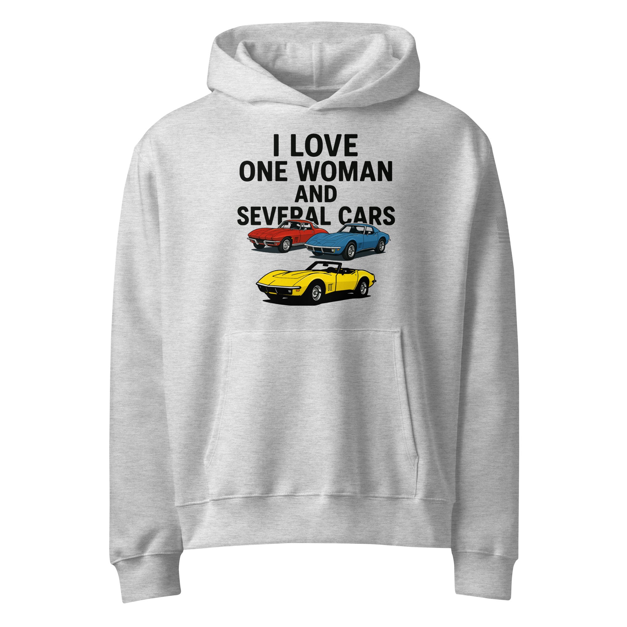 oversized heavyweight hoodie with ‘One Woman Several Cars’ text printed on the front — features a soft brushed fleece interior, double-layered hood without drawcords, front kangaroo pocket, and a roomy unisex fit — displayed in multiple color options.”