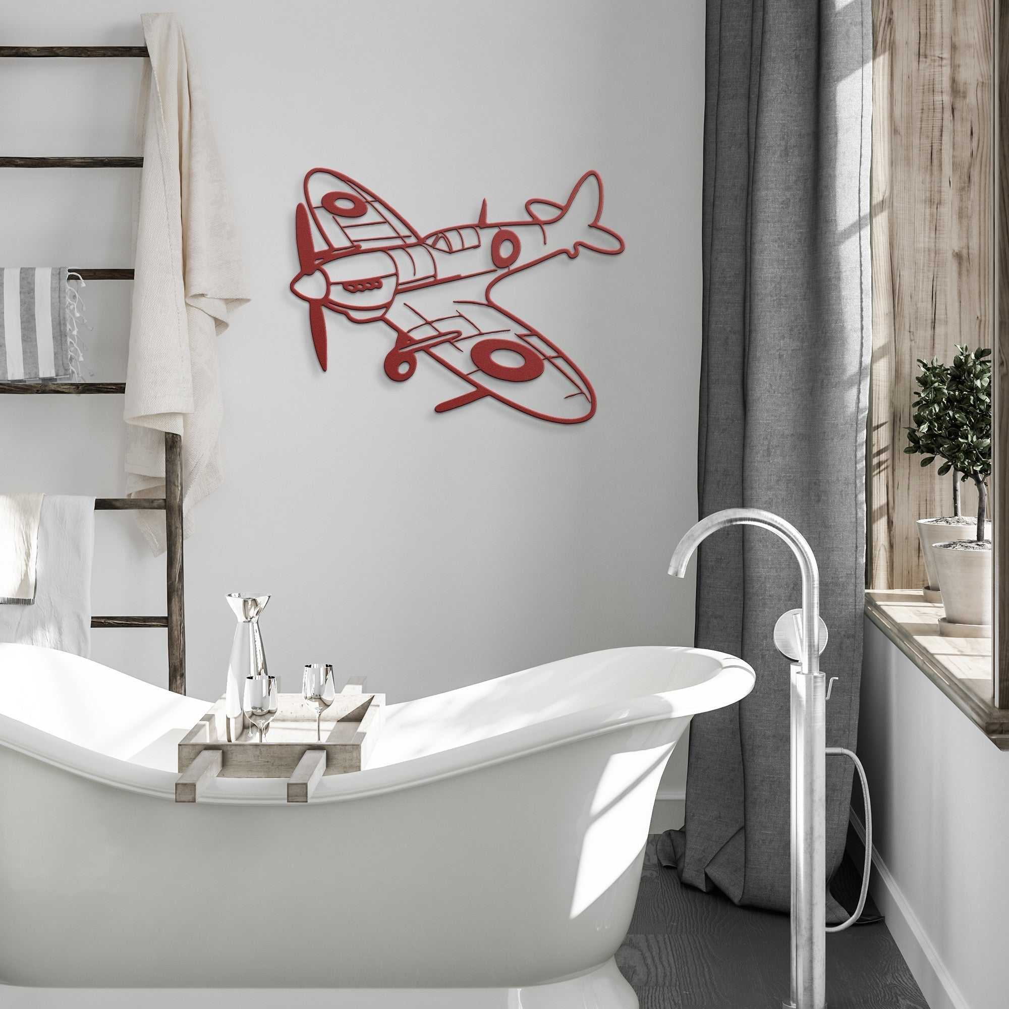 Spitfire WWII Fighter Metal Wall Art in red metal hanging on bathroom wall above bathtub