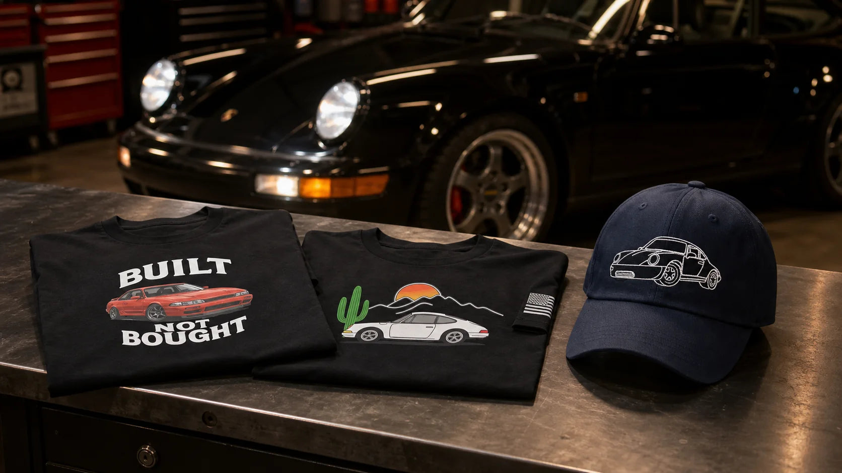 Prop and Piston automotive shirts and embroidered car cap displayed in a performance garage