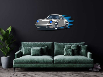 Garage wall decor steel art featuring a multicolor performance coupe silhouette mounted on a black wall above a green velvet sofa with decorative pillows and a potted plant nearby