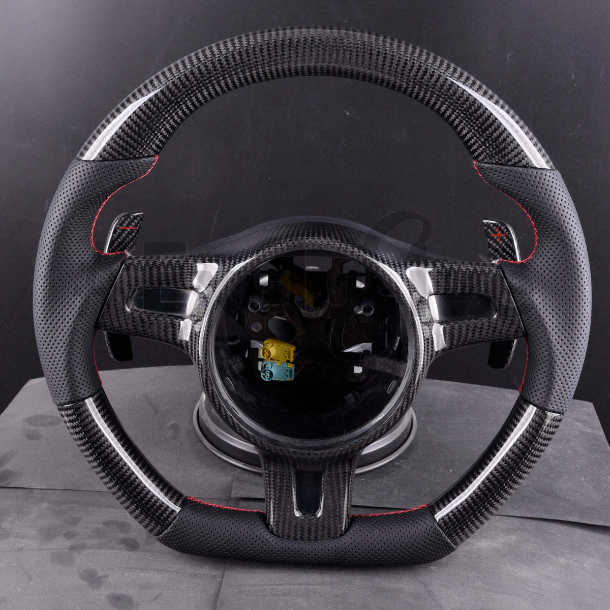 Porsche steering wheel 2009-2016 featuring carbon fiber texture and sleek design, perfect for 911, GT3, Boxster, Cayman, Cayenne, and Panamera.