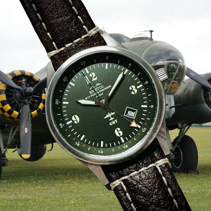 B-17 Tribute watch with stainless brush finish, dark green dial, and brown leather band featuring B-17 airframe artifact