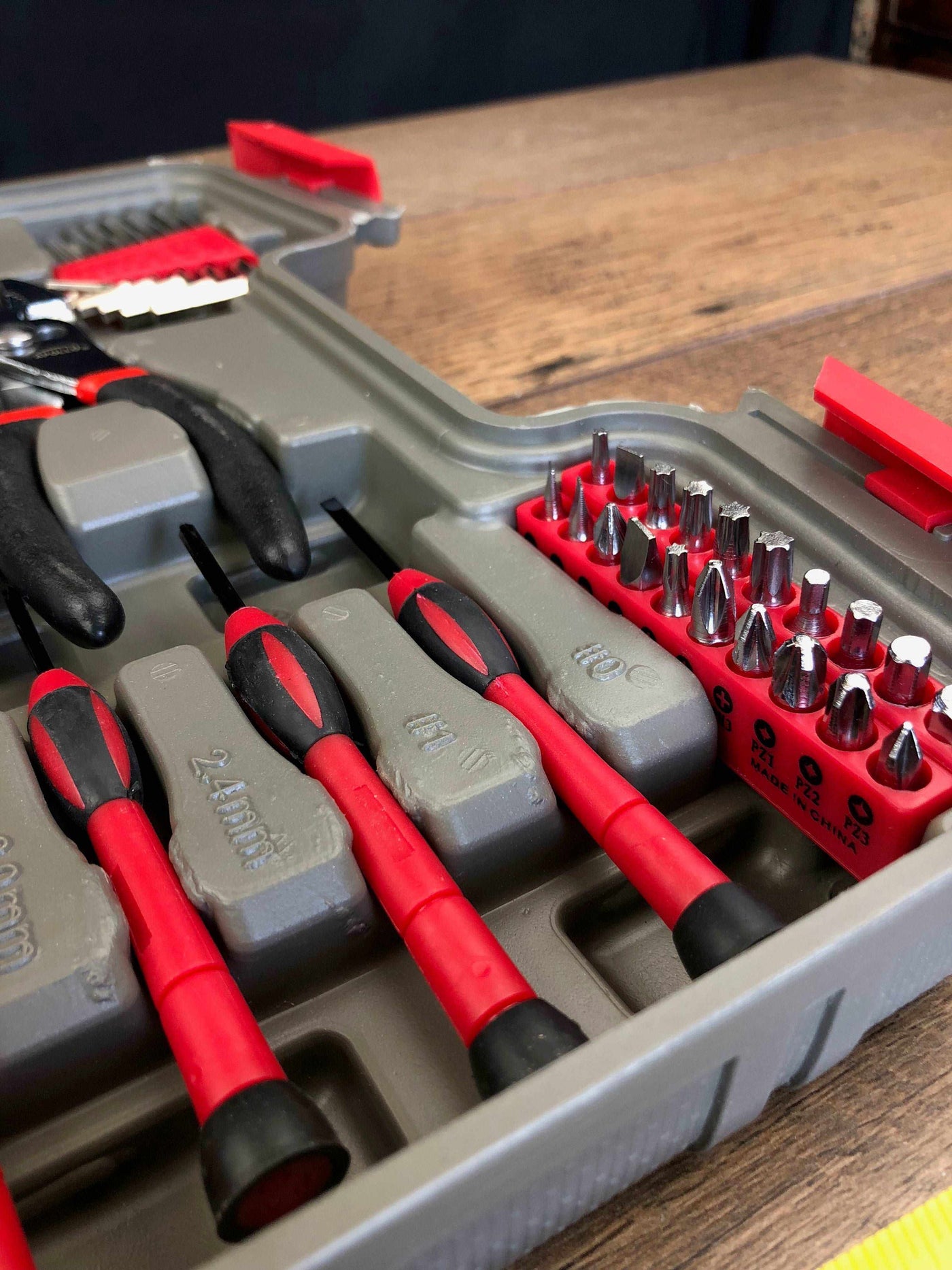 39 Piece General Tool Set with red-handled screwdrivers, pliers, and assorted bits in a compact gray storage case