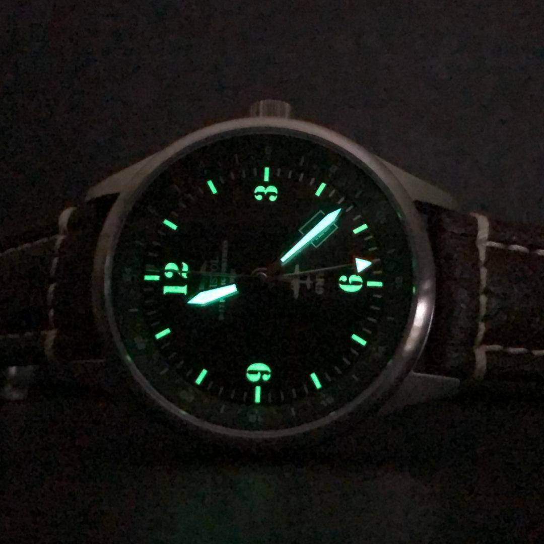 B-17 Tribute watch with stainless brush finish, dark green dial, and brown leather band with stitching