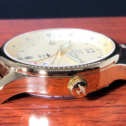B-17 Tribute watch with gold finish, beige dial, stainless steel case, and brown leather band
