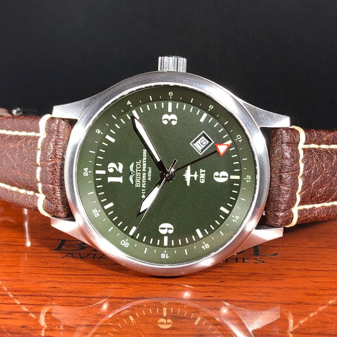 B-17 Tribute watch with stainless brush finish, dark green dial, and brown leather band